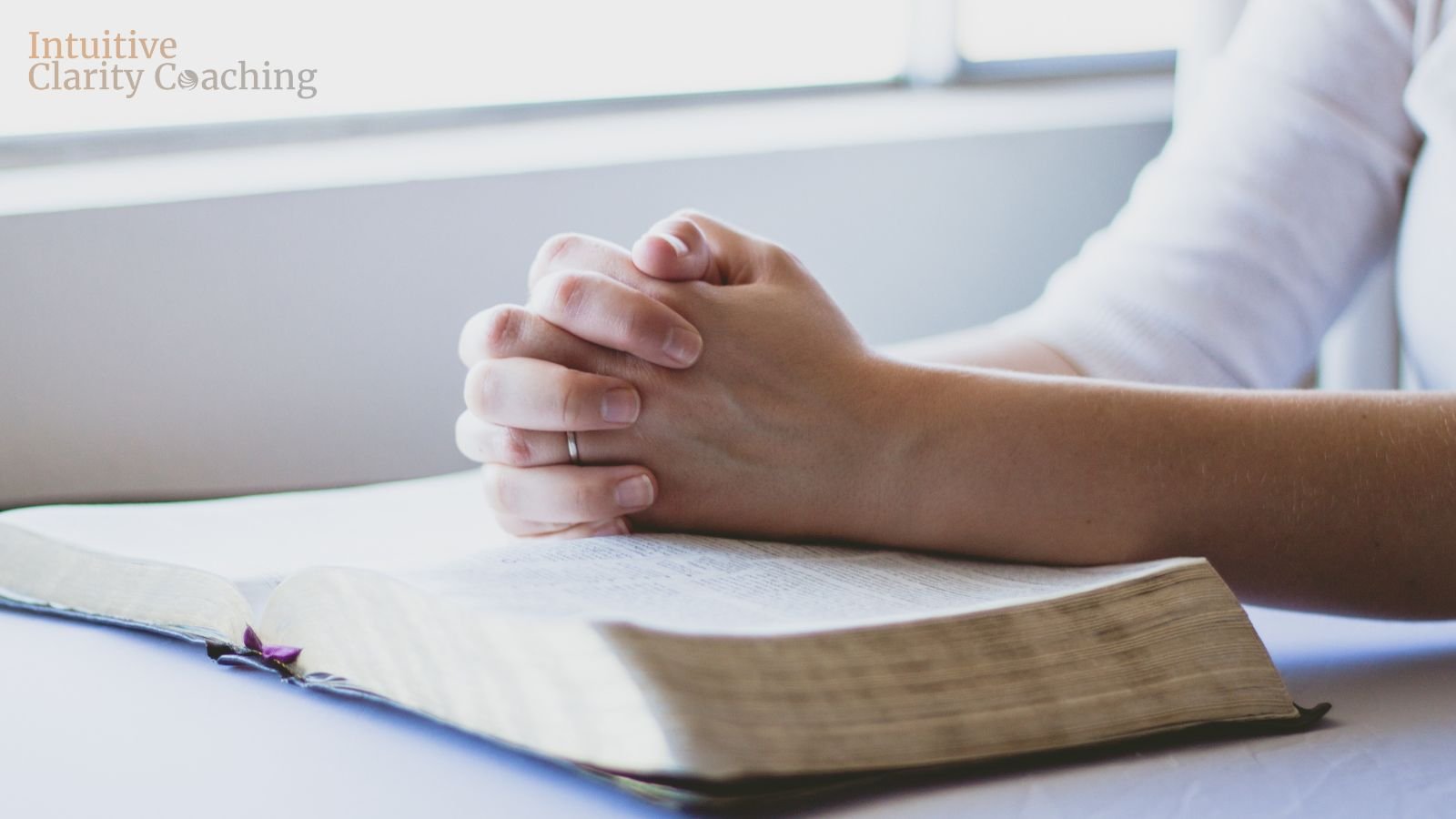 person praying on bible